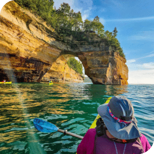 Person kayaking looking at Lovers Leap in Pictured Rocks